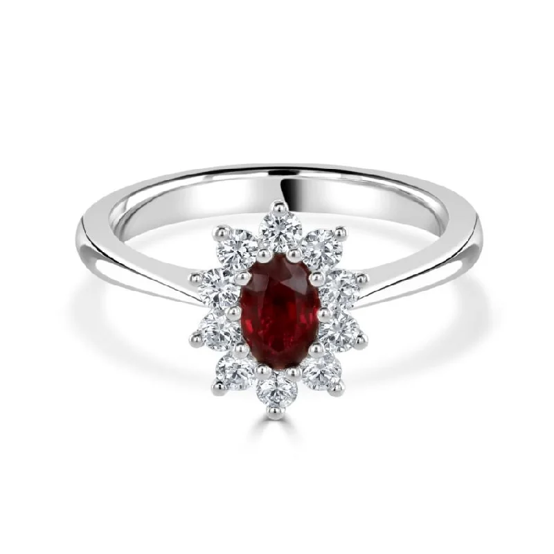 Platinum oval ruby and diamond cluster claw set ring